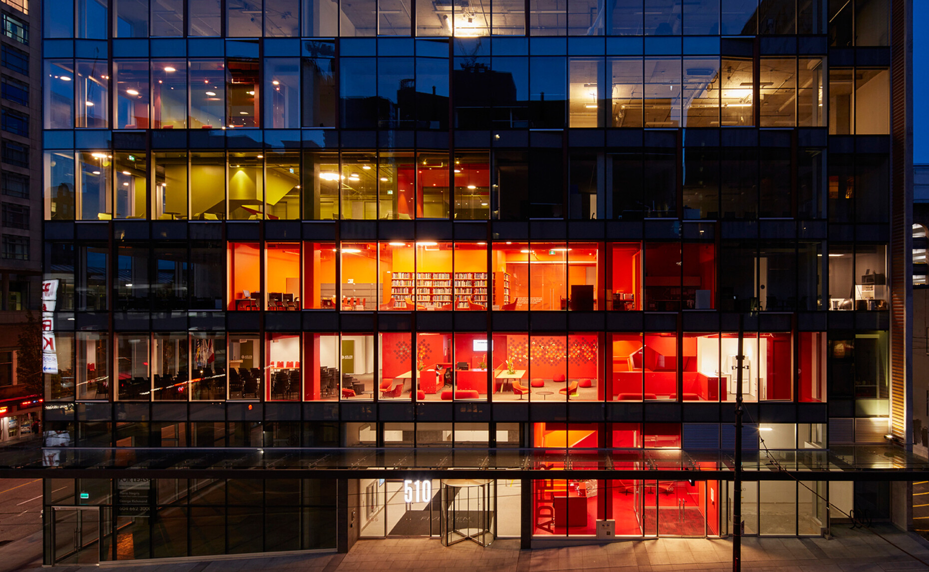 Each of the five stories of the downtown glass tower is in one of the university’s colors: red, brown, green and orange.
