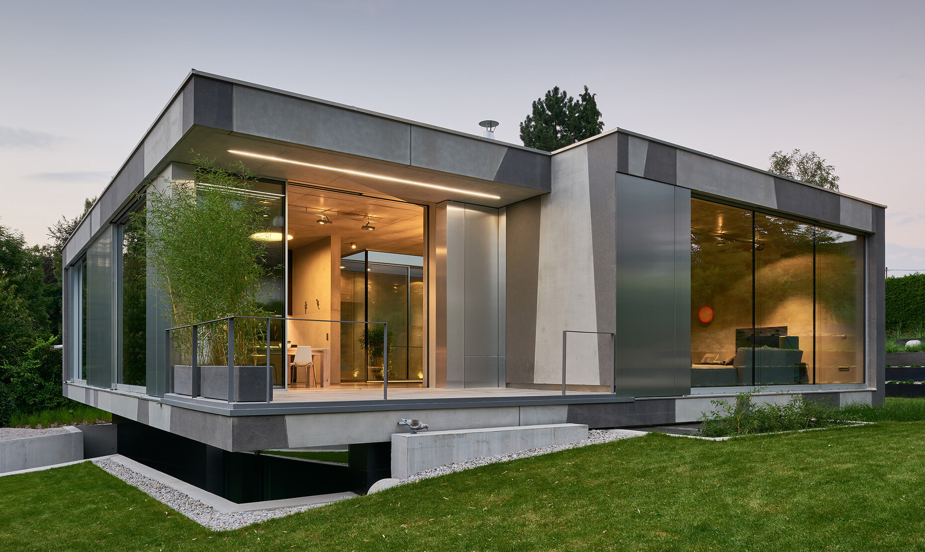 Balanced: Thanks to the floor-to-ceiling Solarlux glazing Dank the pared-down building with tis fair-faced exterior blends harmoniously with the typical architecture on the shores of Starnberger See.