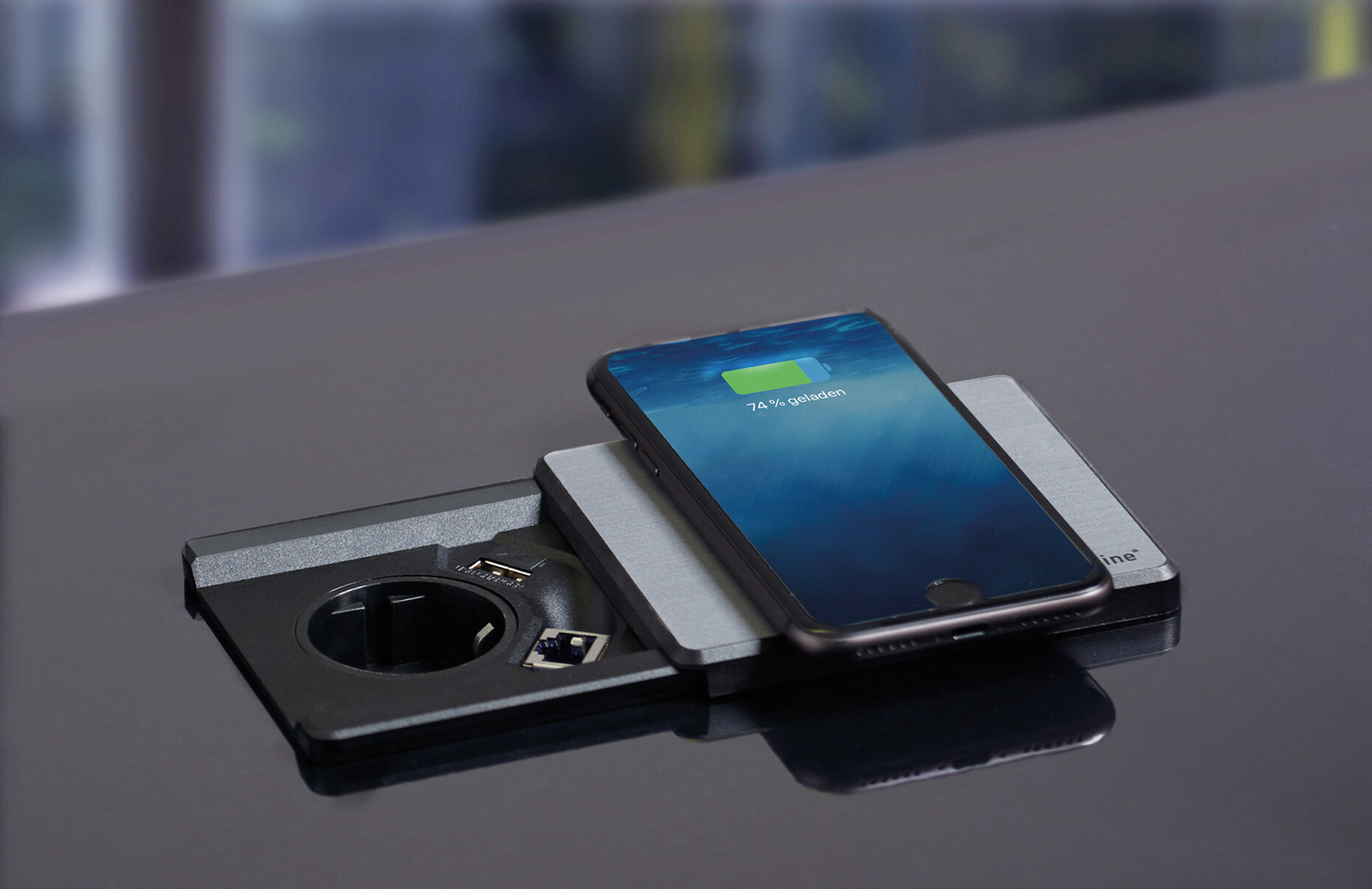 "Evoline Square80" combines many solutions in one product: The socket is equipped with a USB charger, an inductive charging station and optionally with a network connection.