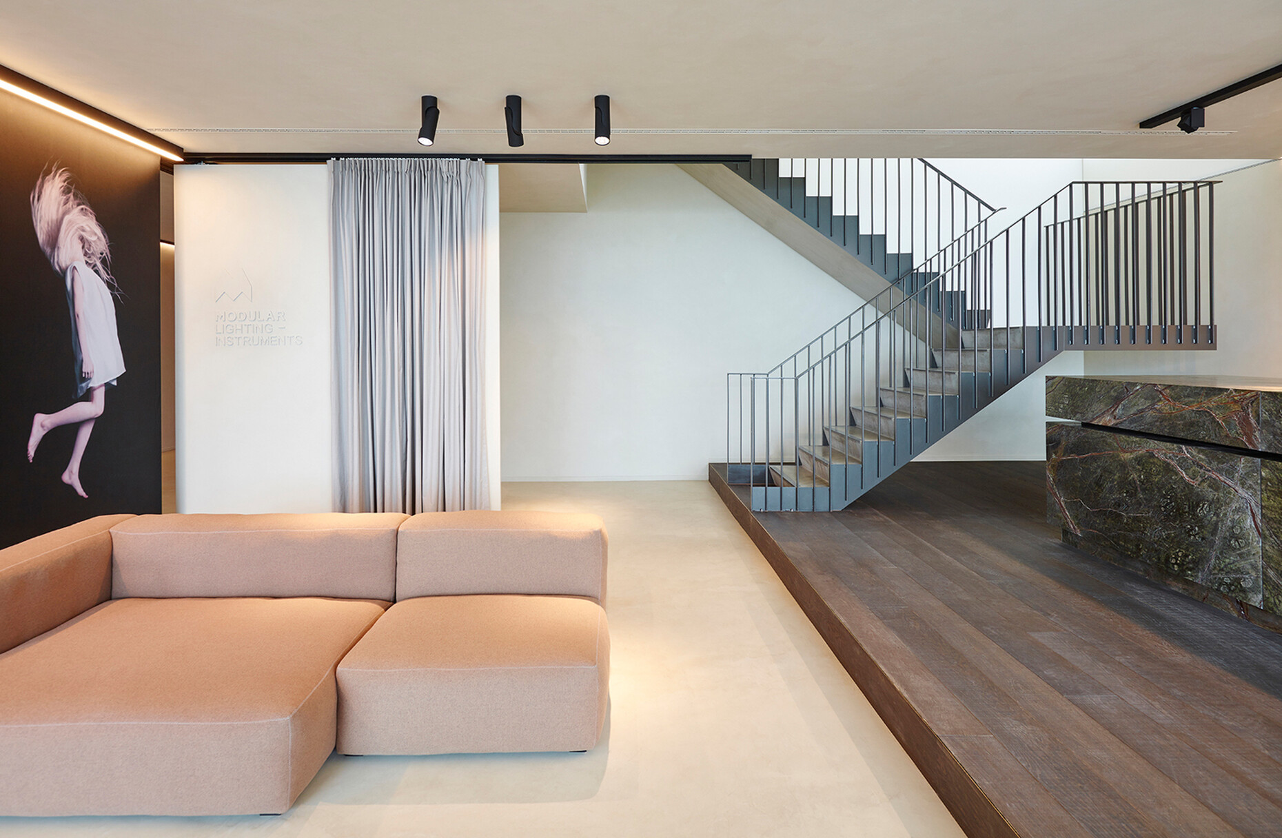 The multifunctional lounge on the ground floor of their headquarters in Roeselare near Ghent in Belgium was decked out in tranquil earth tones.