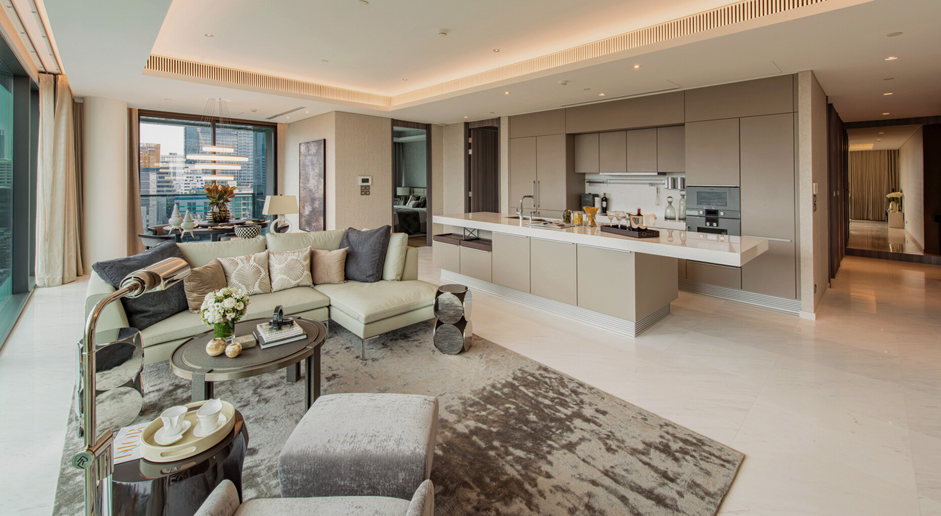The spacious living rooms in the new Sindhorn Tonson luxury complex leave plenty of room for hospitality with an open cooking area.