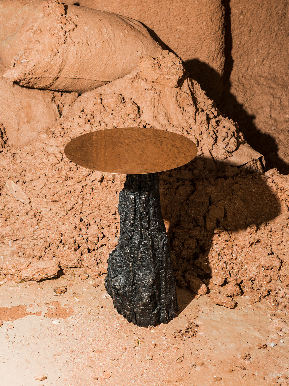 Table from the "Fuoco" series, for which Sironi had charred wood cast in bronze.