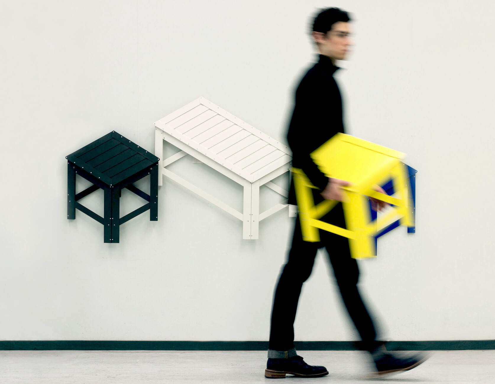 Folded up can the seats hung like decorative prints on the wall to save space.